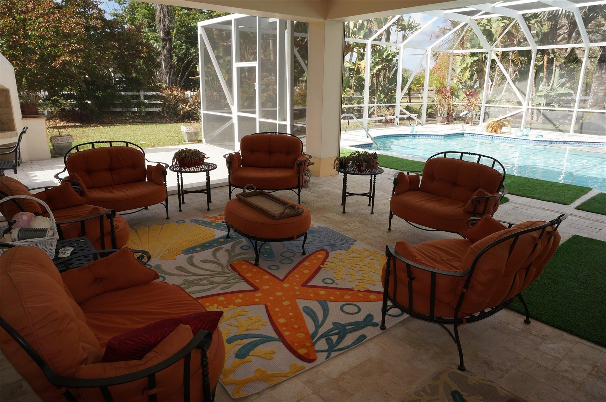 650 East Rambling Drive Wellington, FL 33414 - Photo 54 of 75 a outdoor living space with patio furniture and a large window