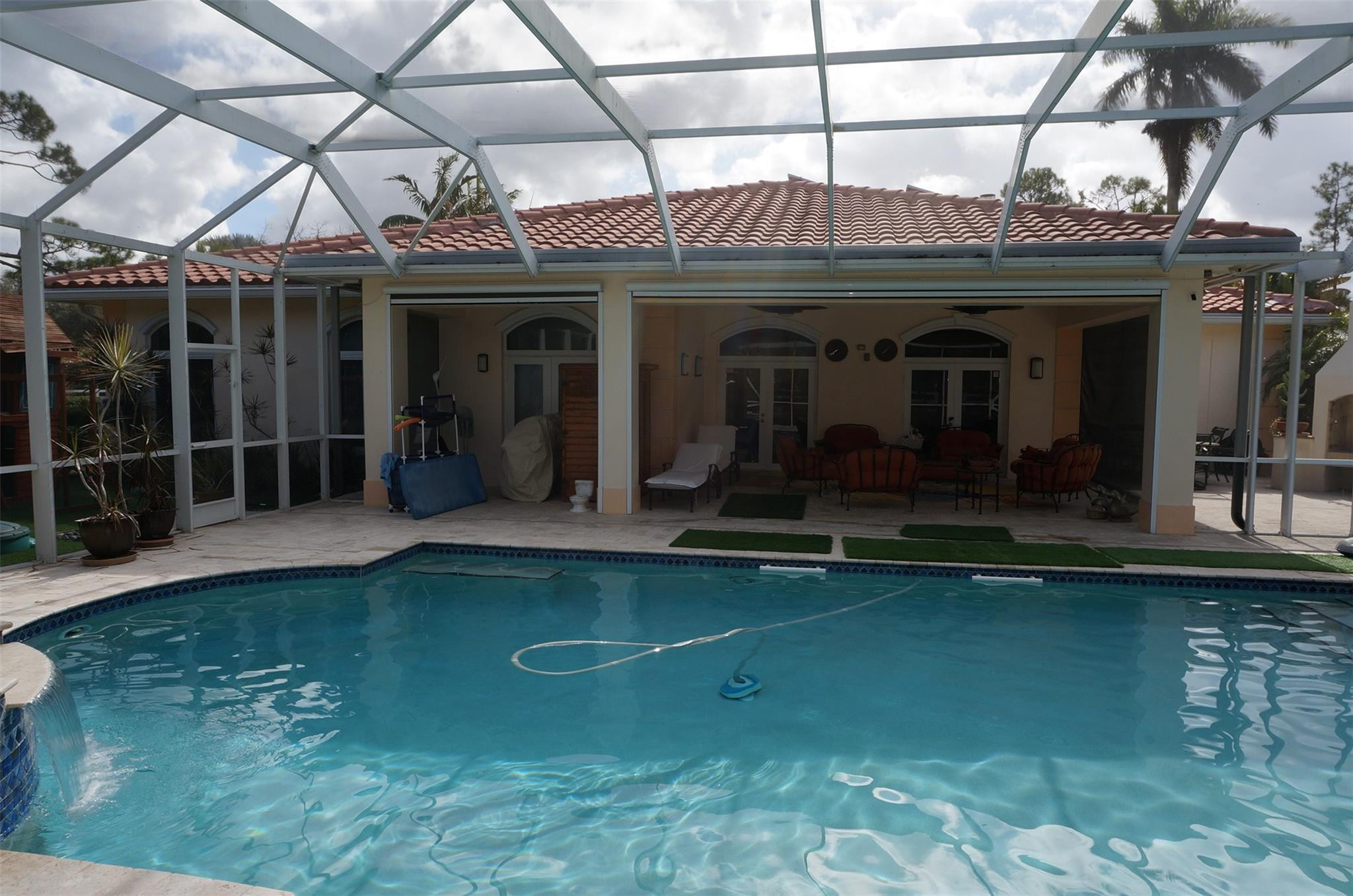 650 East Rambling Drive Wellington, FL 33414 - Photo 58 of 75 a view of a house with swimming pool and sitting space