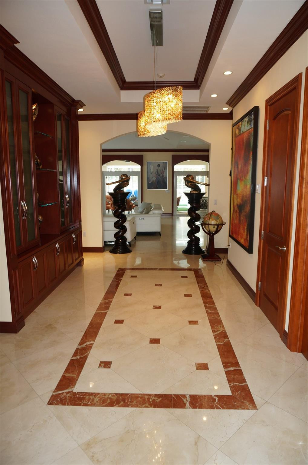 650 East Rambling Drive Wellington, FL 33414 - Photo 6 of 75 a living room with fireplace furniture and a chandelier