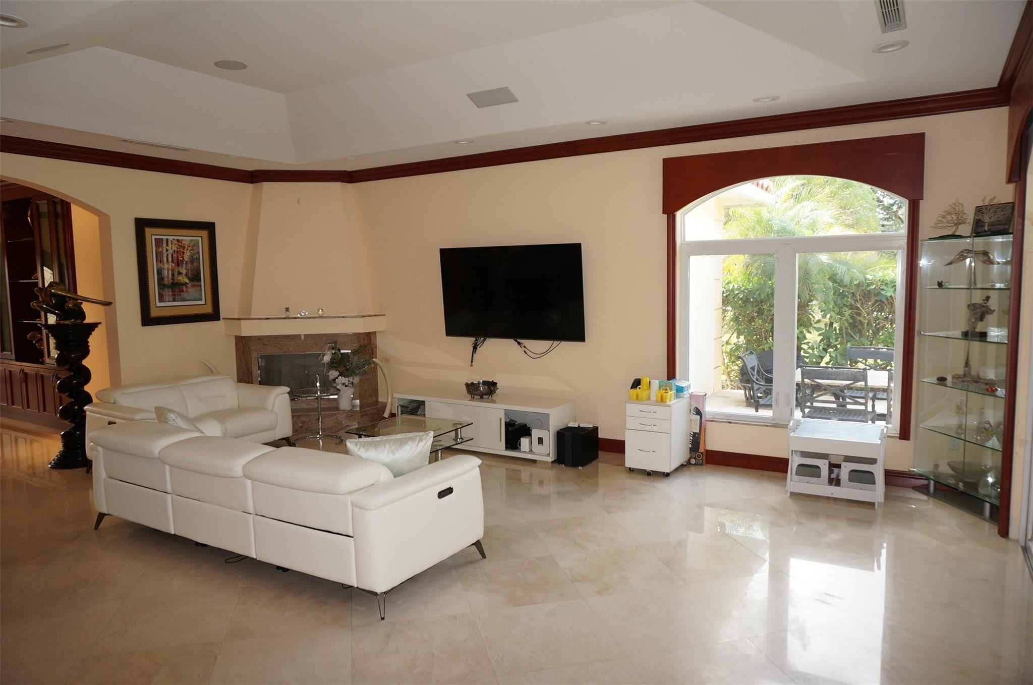 650 East Rambling Drive Wellington, FL 33414 - Photo 8 of 75 a living room with furniture and a flat screen tv