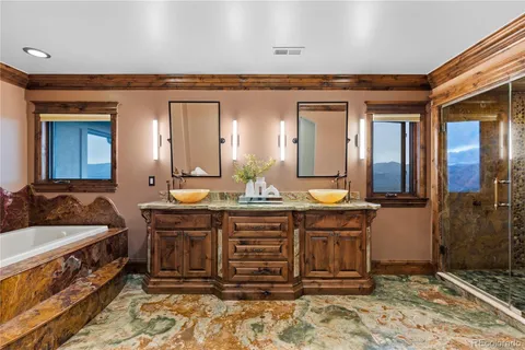 a bedroom with a bed wooden floor and window