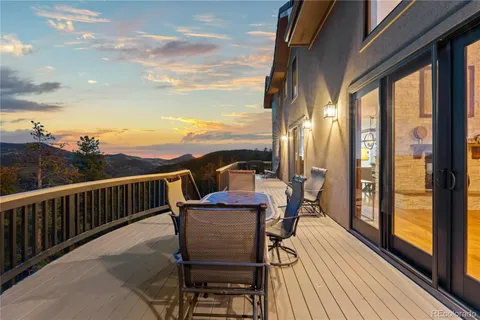 a view of a roof deck with wooden floor