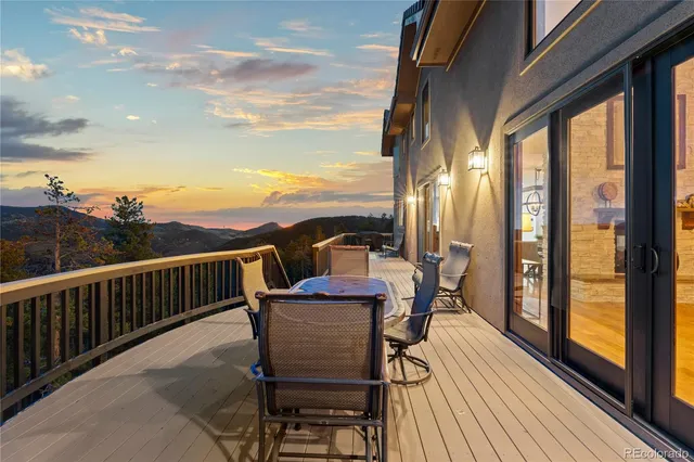 a view of a roof deck with wooden floor