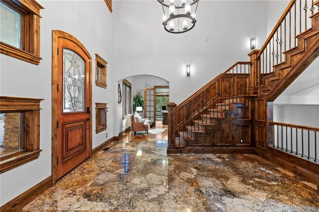 a view of entryway livingroom and hall with wooden floor