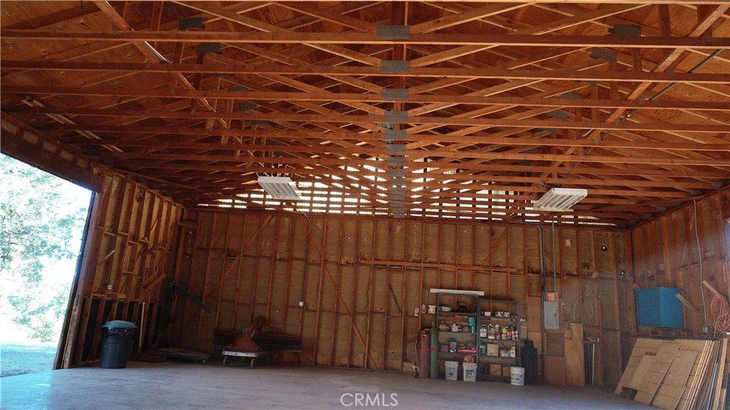 5665 East Whitlock Road Mariposa, CA 95338 - Photo 7 of 24 a view of a room with wooden walls