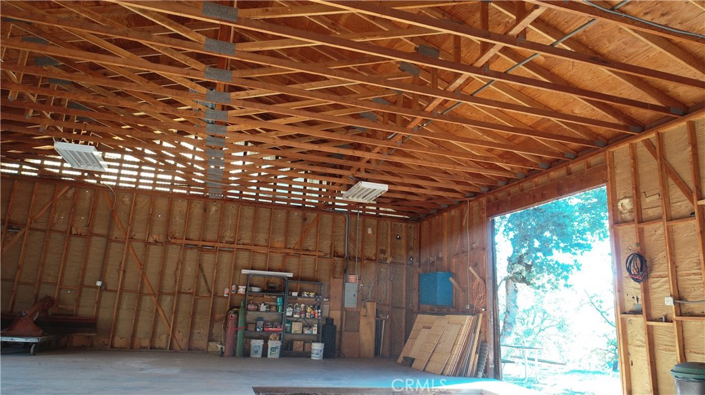 5665 East Whitlock Road Mariposa, CA 95338 - Photo 8 of 24 a view of a room with wooden walls