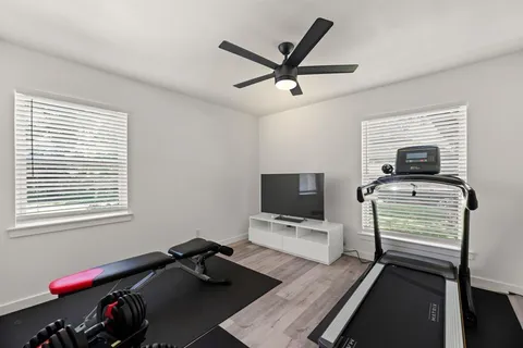 a bedroom with furniture and a window