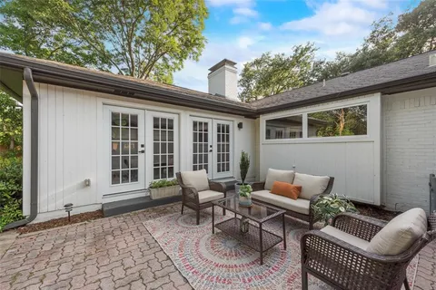 a backyard of a house with seating space