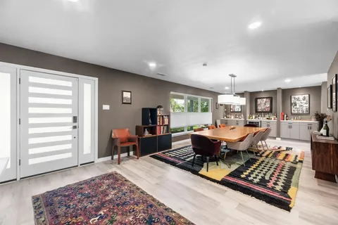 a living room with furniture rug and window