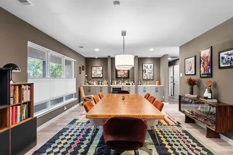 a view of a living room and dining room