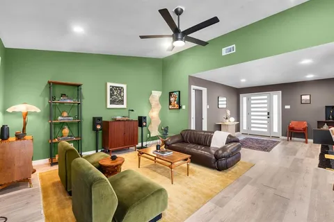 a living room with furniture and a large window
