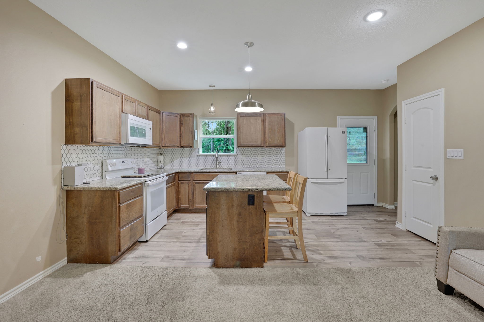 97 Harrell Road Coldspring, TX 77331 - Photo 6 of 31 The kitchen has an island with breakfast bar