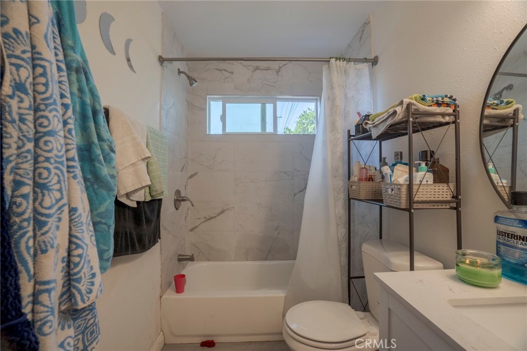 9727 Glandon Street Bellflower, CA 90706 - Photo 24 of 40 a bathroom with a sink toilet and shower