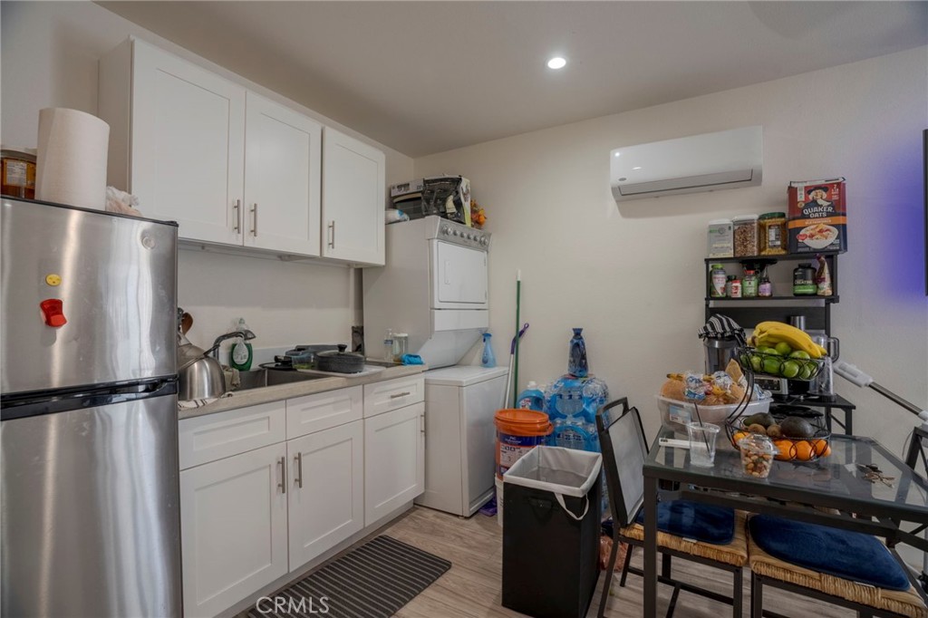 9727 Glandon Street Bellflower, CA 90706 - Photo 35 of 40 a room with furniture a rug and a window