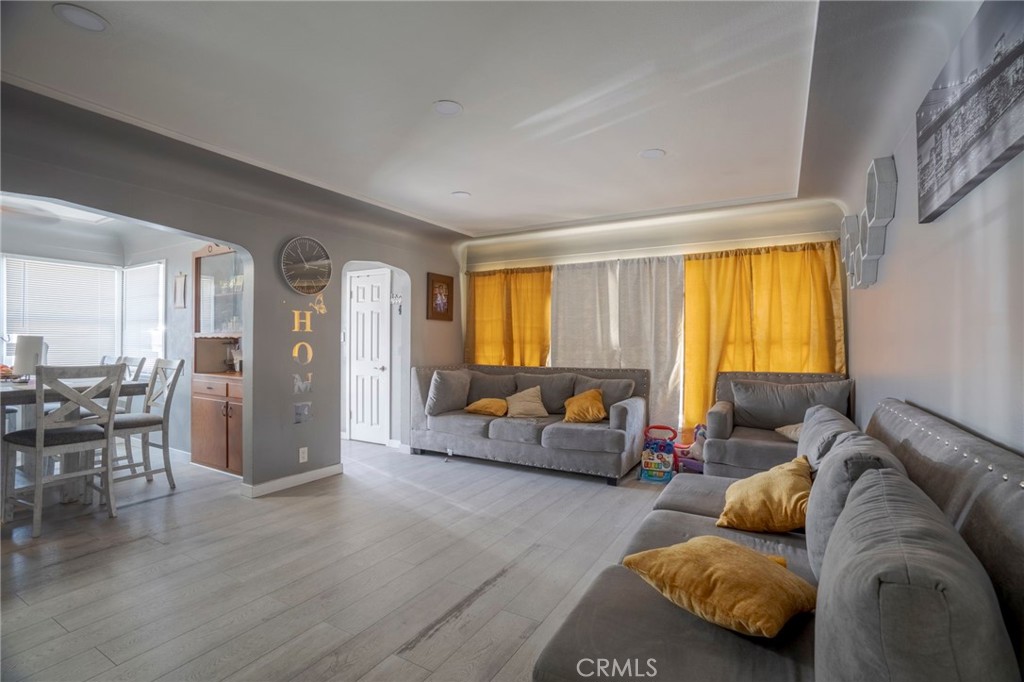 9727 Glandon Street Bellflower, CA 90706 - Photo 6 of 40 a living room with furniture and a window