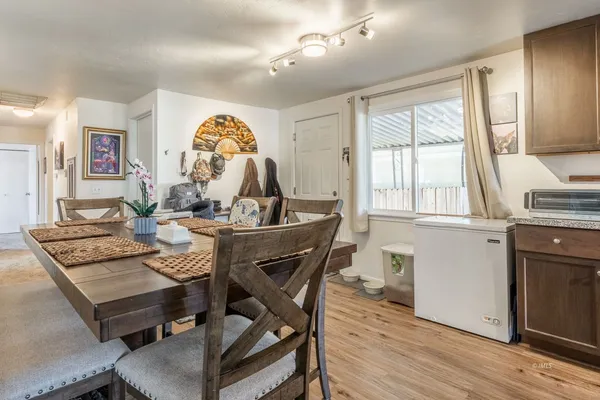 a view of a dining room with furniture window and wooden floor