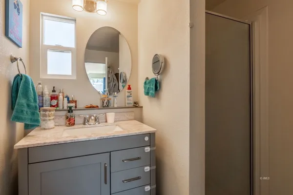 a bathroom with a sink and a mirror