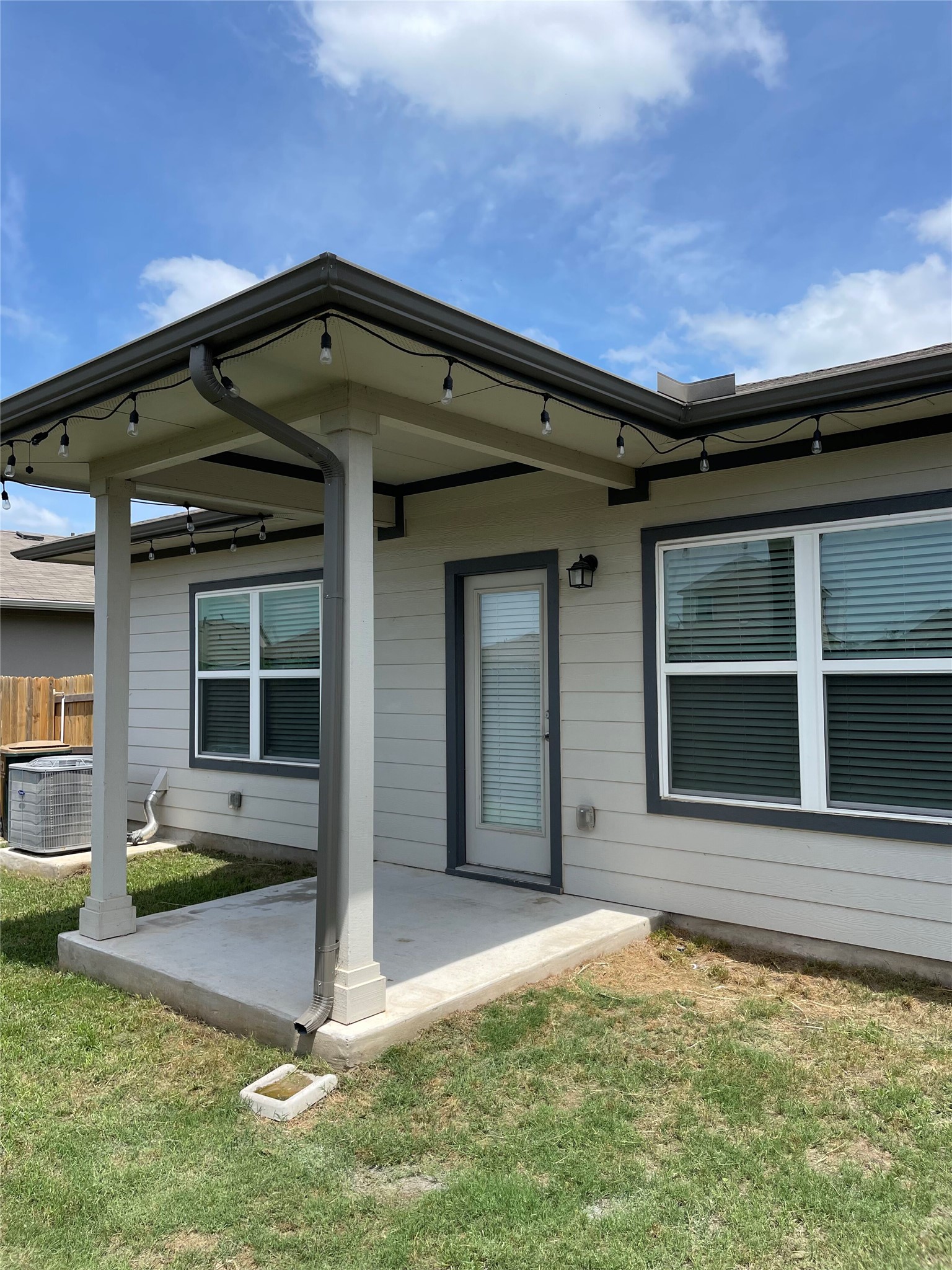 5128 Vanner Path Georgetown, TX 78626 - Photo 19 of 20 Rear exterior featuring a covered concrete patio.