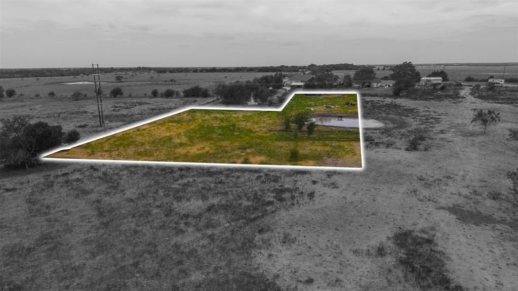 0 Co Road Crandall, TX 75114 - Photo 12 of 14 Expansive land parcel with a natural pond and varying levels of vegetation