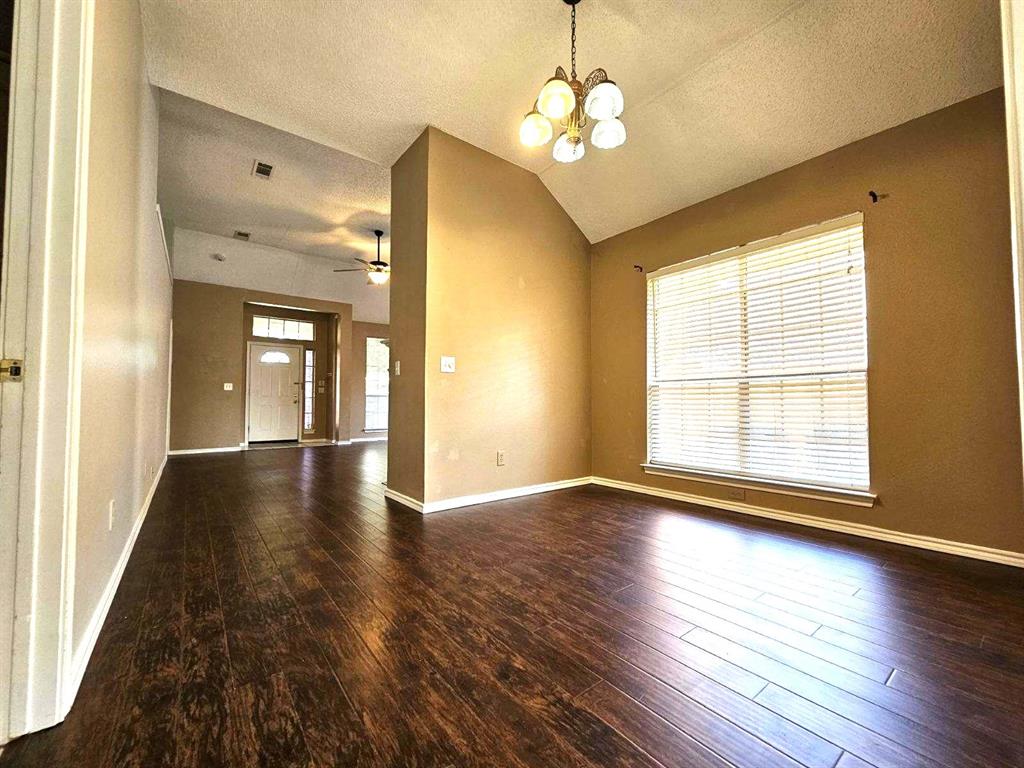 7961 King Arthur Road Frisco, TX 75035 - Photo 13 of 28 a view of livingroom with hardwood floor and window