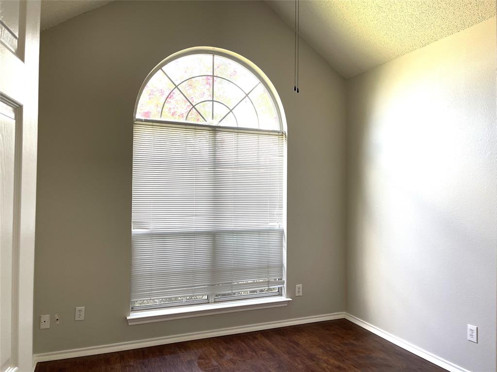 7961 King Arthur Road Frisco, TX 75035 - Photo 17 of 28 an empty room with wooden floor and a window