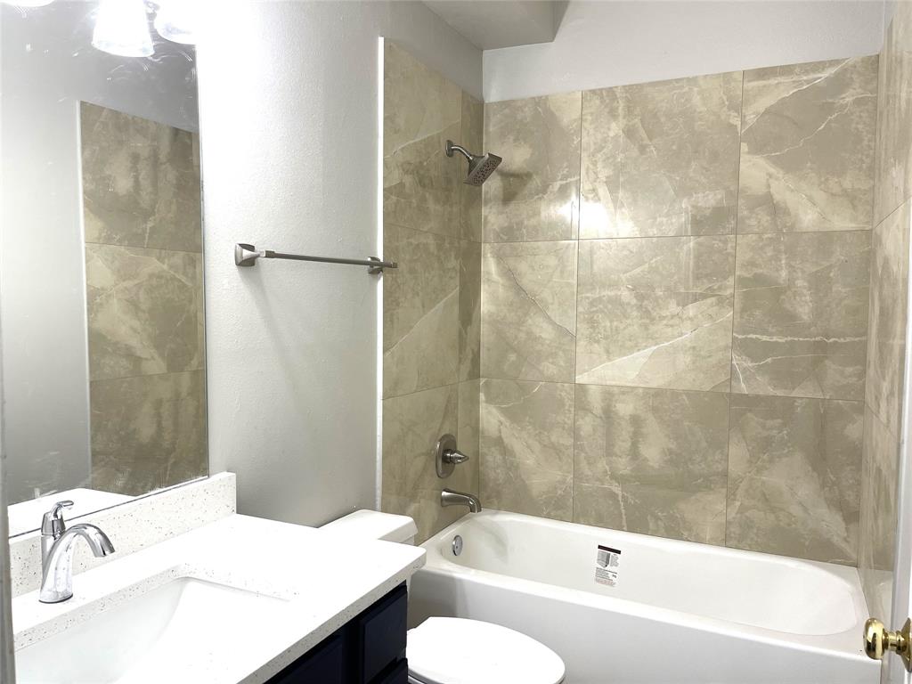 7961 King Arthur Road Frisco, TX 75035 - Photo 21 of 28 a bathroom with a sink and a mirror