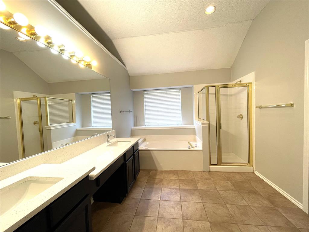 7961 King Arthur Road Frisco, TX 75035 - Photo 24 of 28 a spacious bathroom with a granite countertop sink a bathtub and next to a window