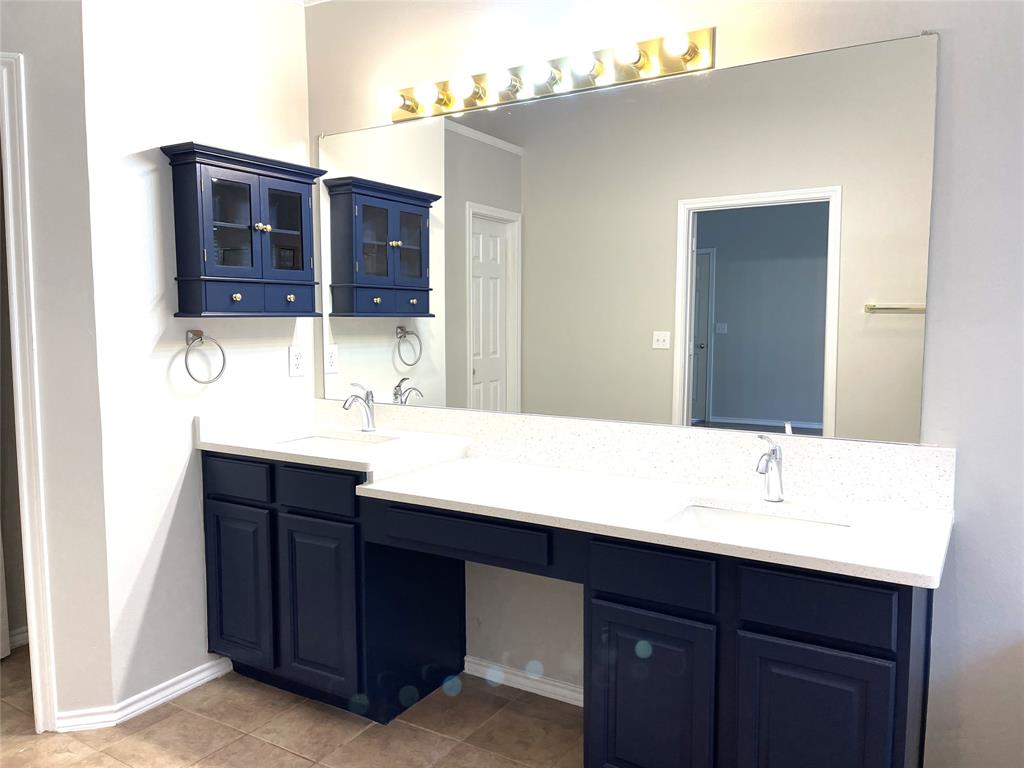 7961 King Arthur Road Frisco, TX 75035 - Photo 26 of 28 a bathroom with a sink and a mirror