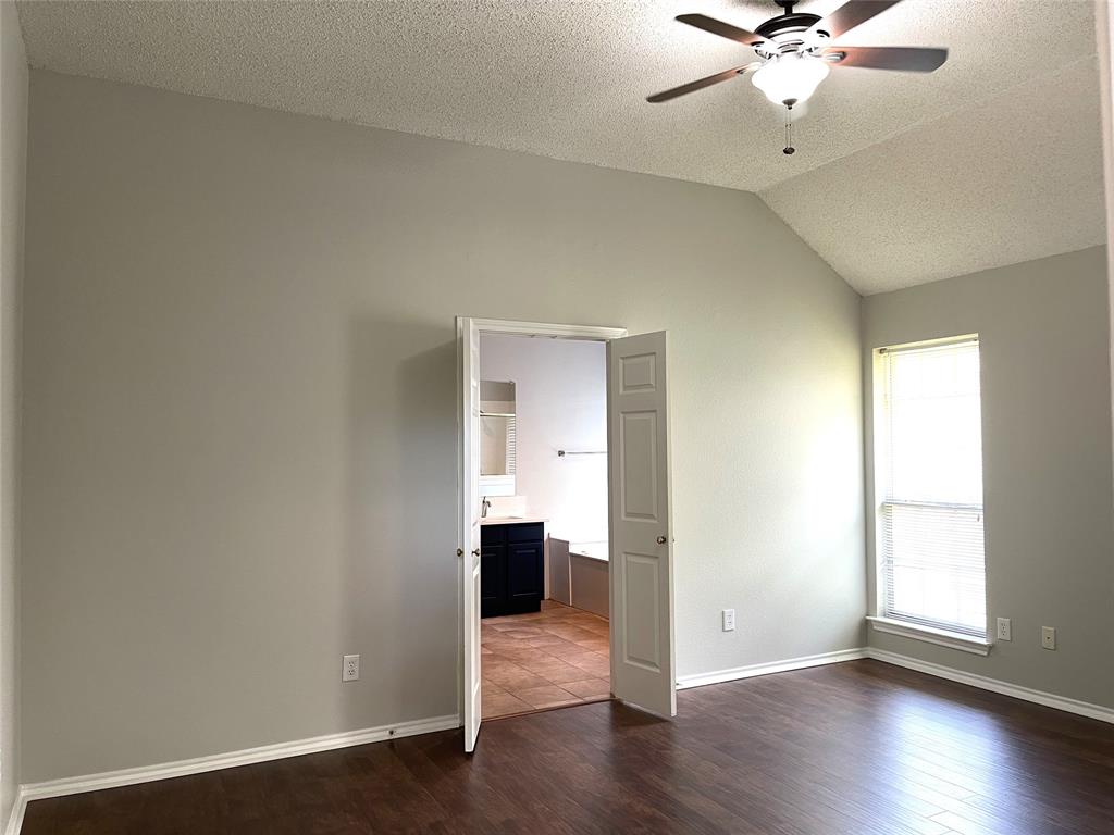 7961 King Arthur Road Frisco, TX 75035 - Photo 28 of 28 an empty room with wooden floor closet and windows