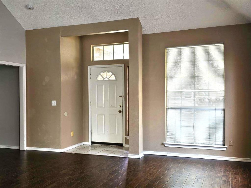 7961 King Arthur Road Frisco, TX 75035 - Photo 9 of 28 an empty room with wooden floor closet and windows