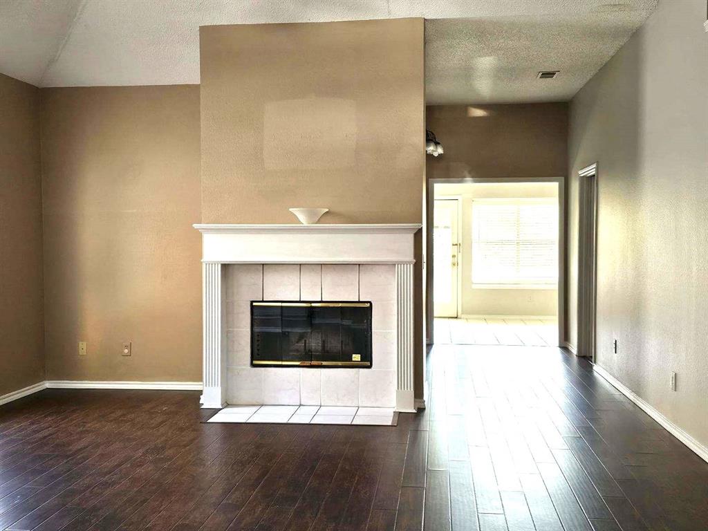 7961 King Arthur Road Frisco, TX 75035 - Photo 10 of 28 a view of an empty room with wooden floor and a window