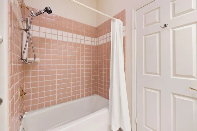 a bathroom with a shower and a bathtub