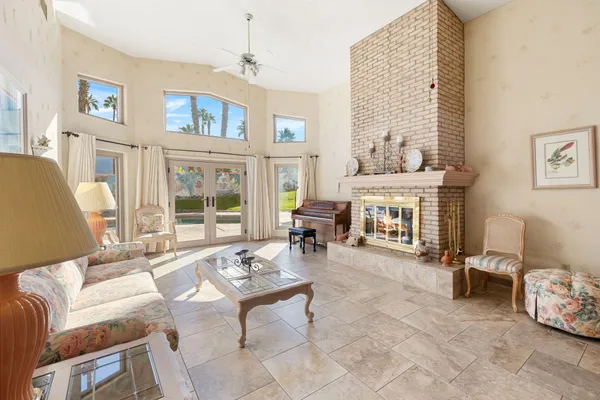a living room with furniture and a fireplace