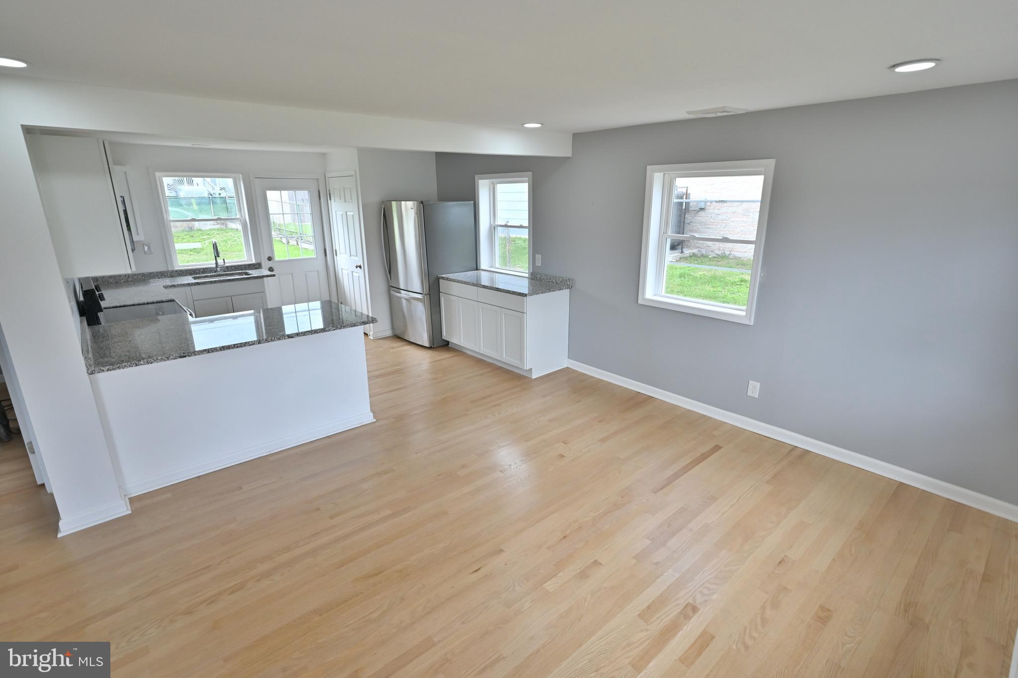 34 Compass Road East Middle River, MD 21220 - Photo 5 of 25 a living room with furniture and a wooden floor