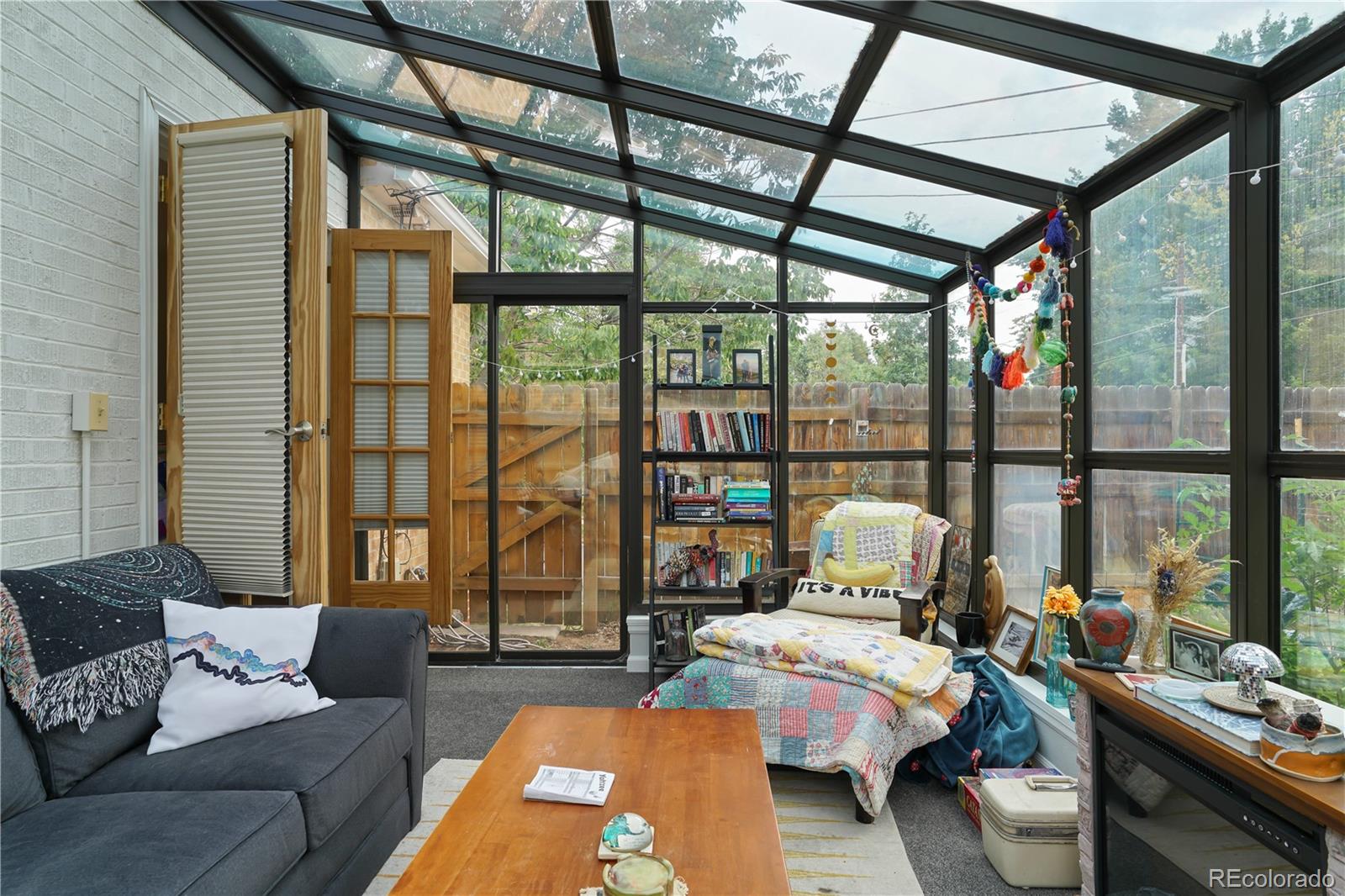 2690 Ash Street Denver, CO 80207 - Photo 12 of 20 a bedroom with furniture and a large window
