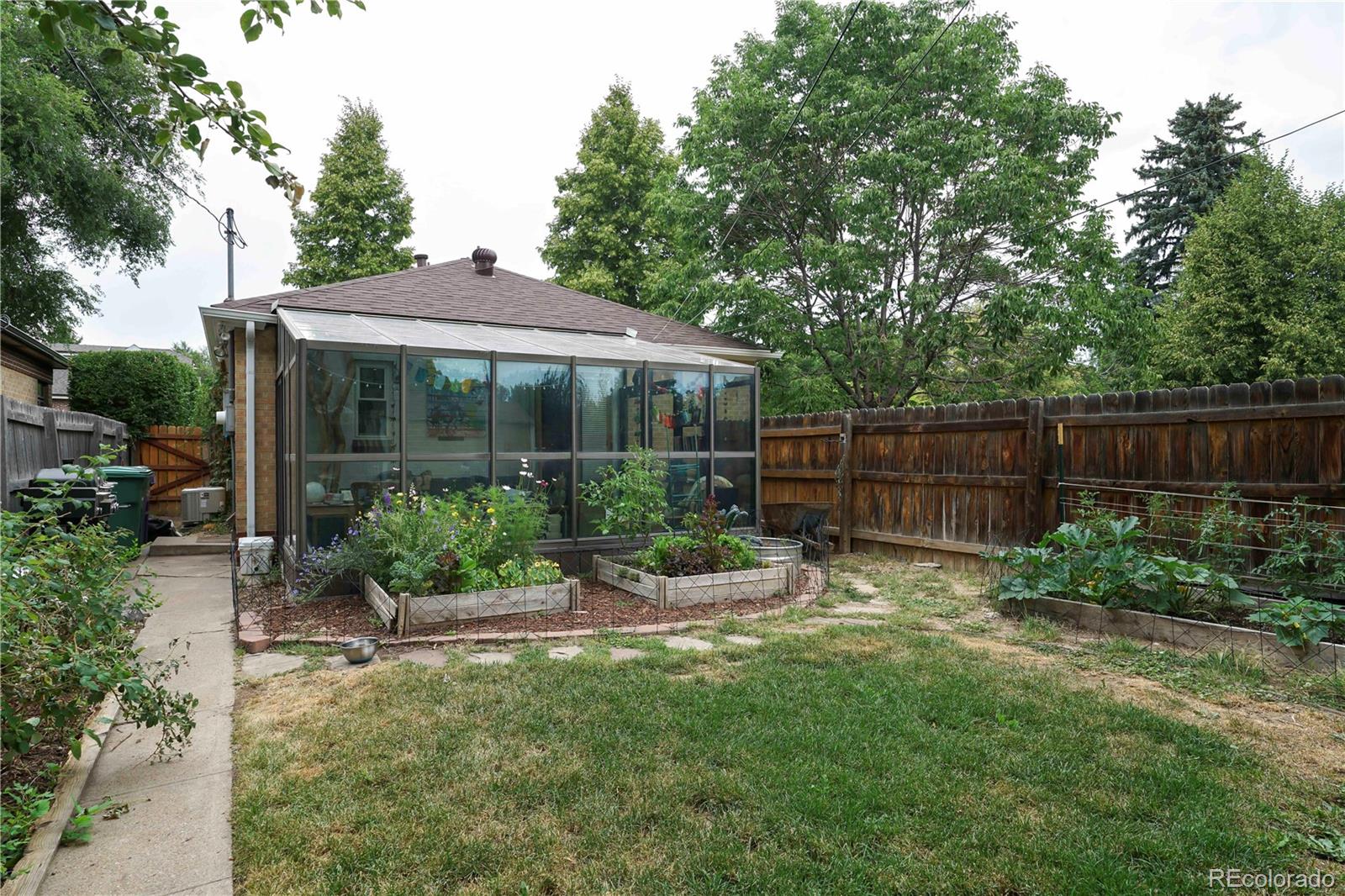 2690 Ash Street Denver, CO 80207 - Photo 16 of 20 a view of a garden with an outdoor seating