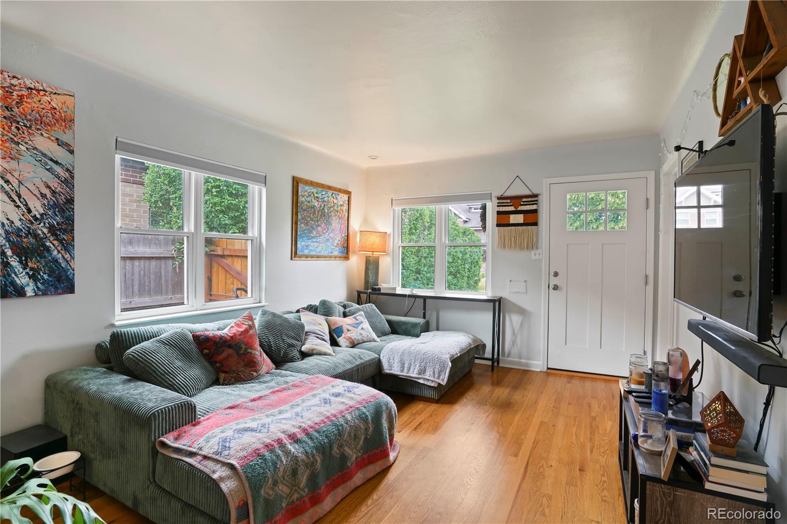 2690 Ash Street Denver, CO 80207 - Photo 2 of 20 a bedroom with two beds and a flat screen tv
