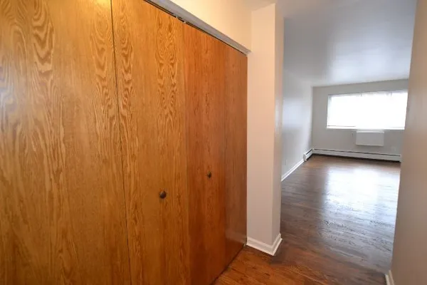 a view of entryway with wooden floor