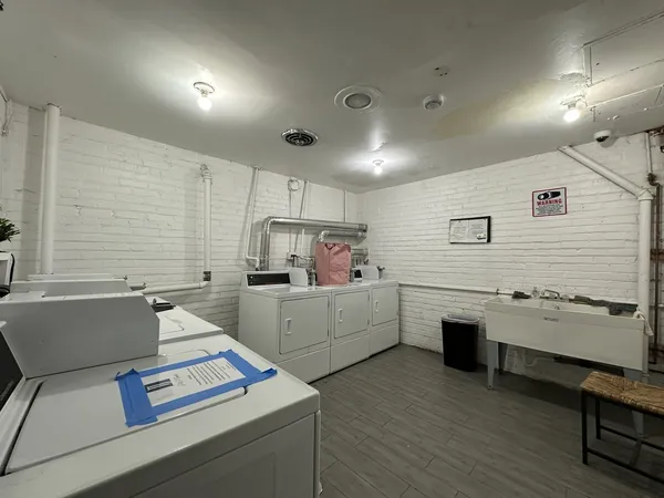 a kitchen that has a sink and a stove