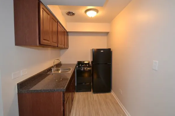 a kitchen with a sink and cabinets