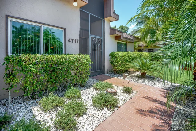 a view of a house with a garden