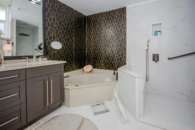 a bathroom with a sink toilet and shower