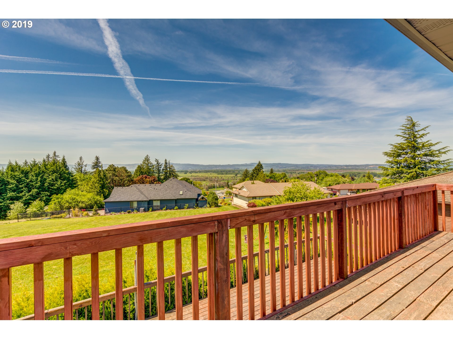 823 South Hillhurst Road Ridgefield, WA 98642 - Photo 27 of 31 a view of a balcony with wooden floor & fence
