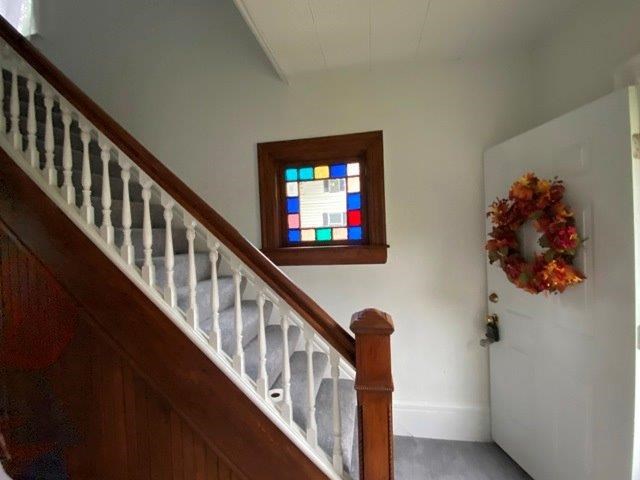 200 Park Avenue Warren, PA 16365 - Photo 6 of 12 a view of staircase with lots of frames on wall and a painting