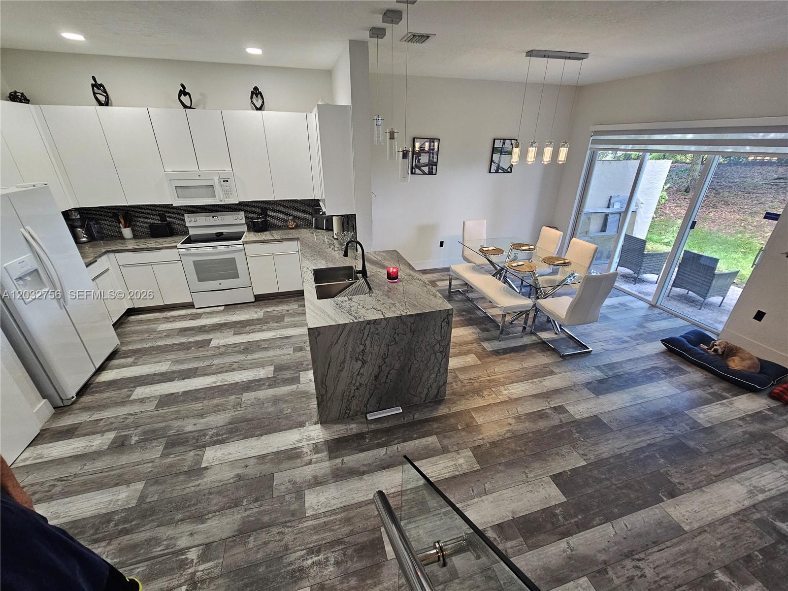 4331 Southwest 124th Way Miramar, FL 33027 - Photo 3 of 40 a living room with furniture and a large window