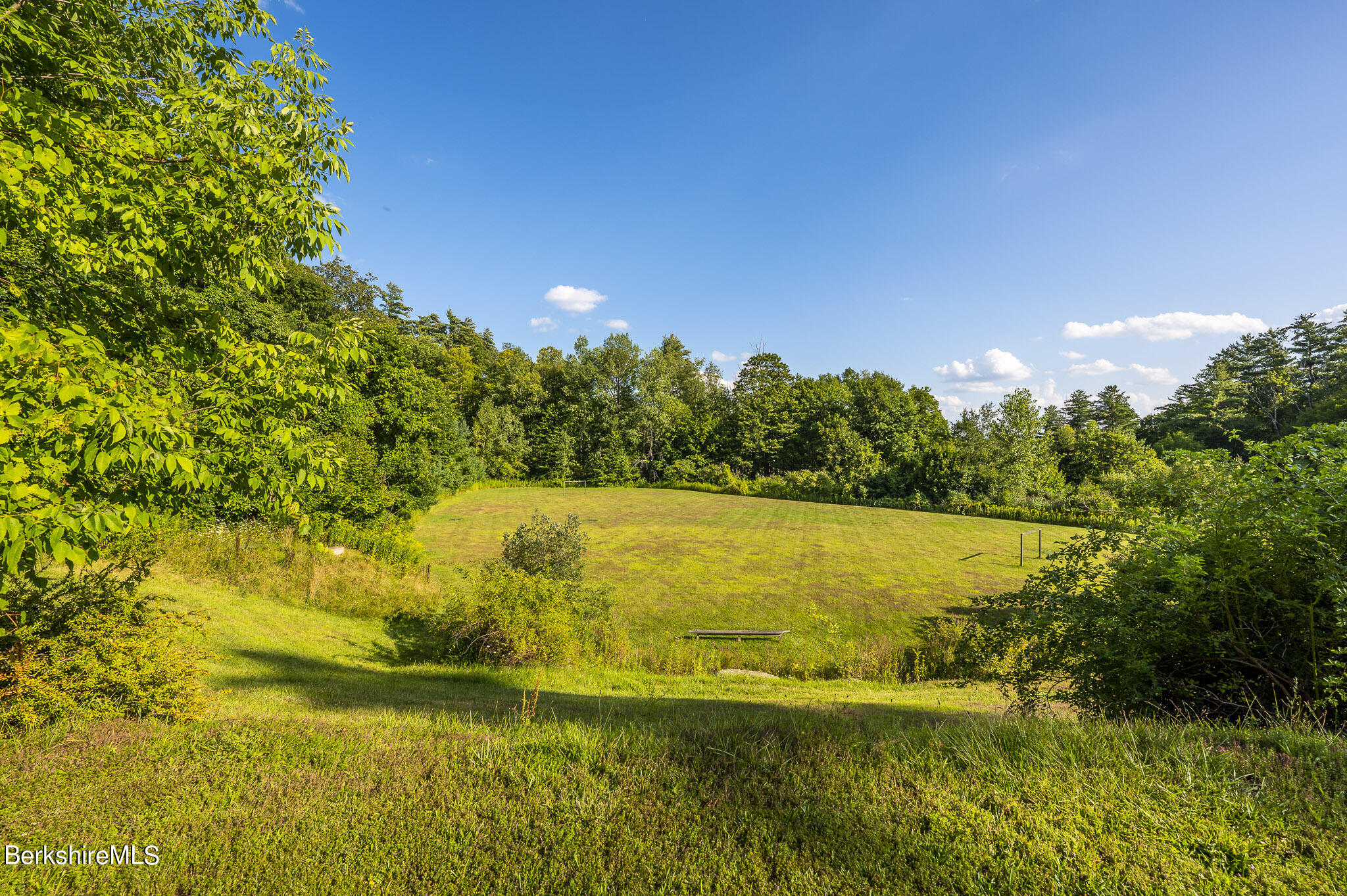 79 Reservoir Road Lenox, MA 01240 - Photo 23 of 36 a view of an ocean from a yard