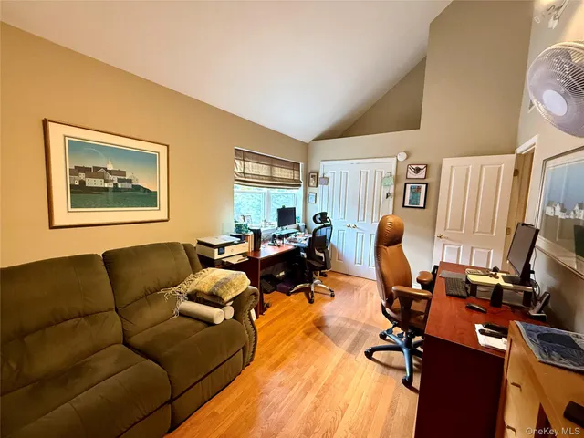 a living room with furniture a couch and a window