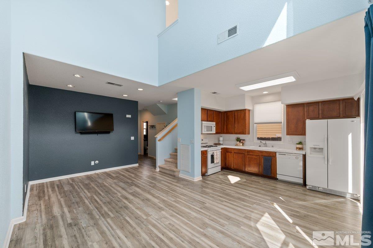 2160 Stanhope Lane Reno, NV 89502 - Photo 12 of 31 a view of a kitchen with refrigerator microwave and stove