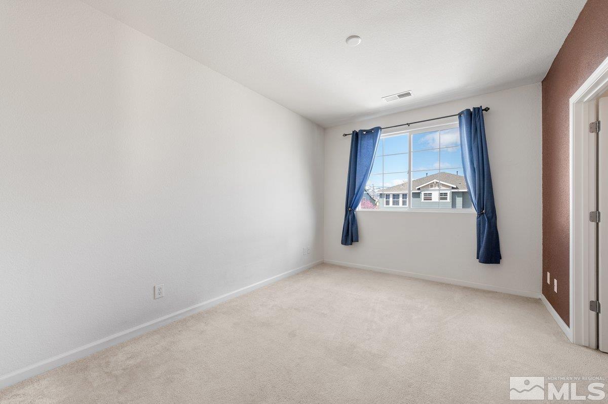 2160 Stanhope Lane Reno, NV 89502 - Photo 19 of 31 a view of an empty room with a window