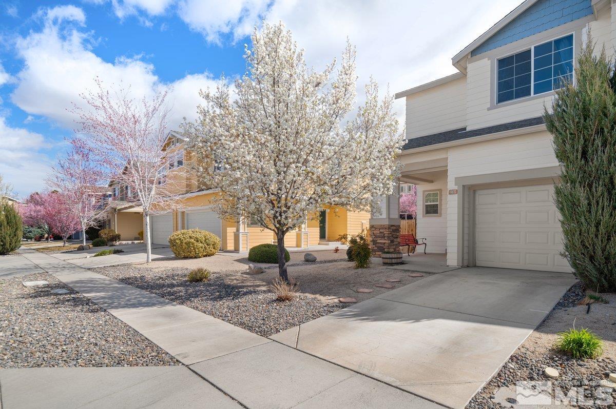 2160 Stanhope Lane Reno, NV 89502 - Photo 2 of 31 a row of palm trees in front of a building